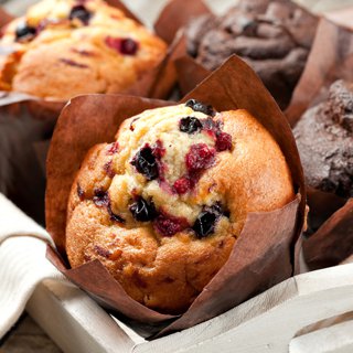 blueberry and chocolate muffins in paper cupcake holder